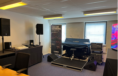 Copenhagen training facility with seating, display screen, and audio demonstration equipment.