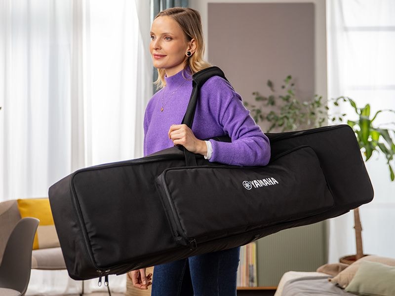 A person carrying the P-143 dedicated keyboard bag on their shoulder