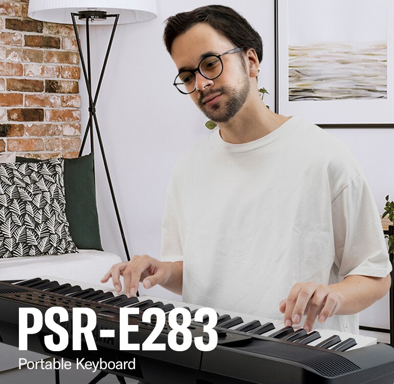 A man playing the PSR-283