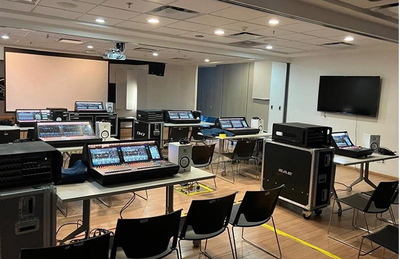 Mexico City training facility with digital mixing consoles, displays, and training room seating.