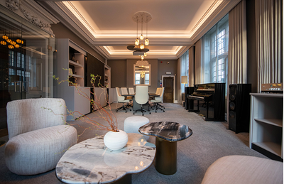 London training facility lounge-style room with seating and presentation area.