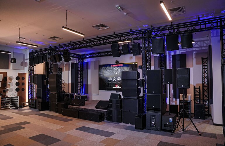Dubai training facility with professional audio equipment, loudspeakers, and lighting setup.
