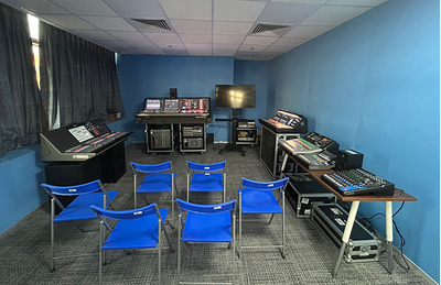 Gurugram training facility with classroom seating, presentation display, and audio training equipment.