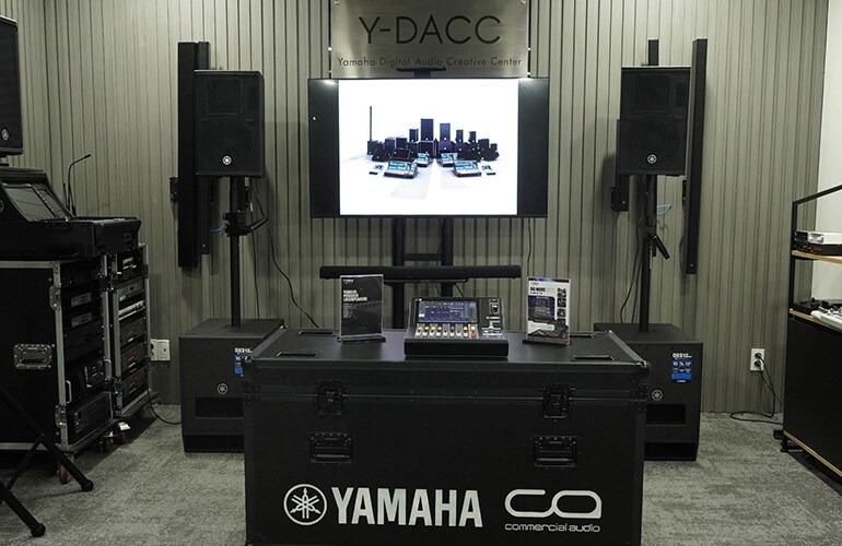 Ho Chi Minh City training facility with digital mixing console, display screen, and loudspeakers.