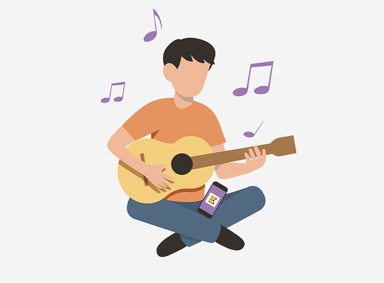 En man som använder musikövningsappen Extrack för att öva med ackordtabeller.