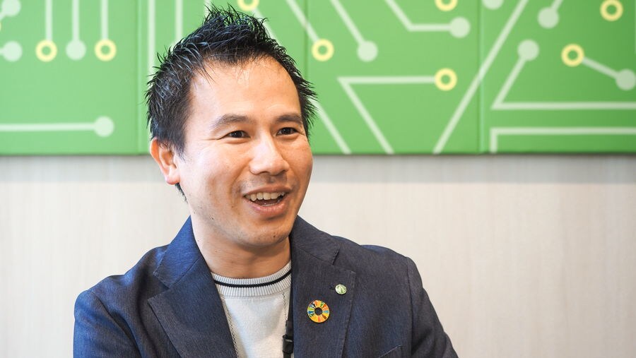 Mr. Takaya speaking during an interview in the office